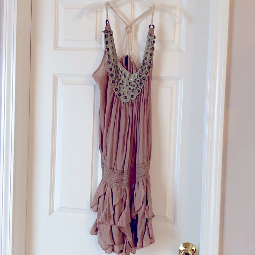 Ruffled tan dress with embellished neckline